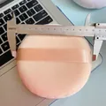 Macro view of extra large 11.5cm velvet powder puff being measured with a caliper - 130mm Super Soft 【Skin Color】