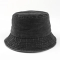 Detailed macro view of high-quality washed denim texture on a dark grey bucket hat - M (56-58cm) / Black