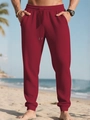 Detalle de pantalones deportivos de punto gofrado granate con cintura con cordón ajuste - S / Burdeos