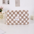 Detail of checkered plush makeup bag with teddy bear patch and woven carrying handle - Khaki