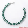 Detail view of flower-shaped tennis bracelet with green crystals measuring 8.0mm in width - Platinum Green Zirconia Bracelet (VL527)