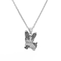 Macro shot of silver metal French Bulldog pendant with black and clear sparkling crystals - Silver French Bulldog