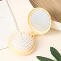 Portable folding mini round hairbrush with mirror in cream beige minimalist finish - Lemon Yellow