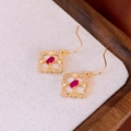 Detailed macro view of gold flower earrings with red ruby stone and white zircon - Ear Hook - Gold (Real Gold Plating)