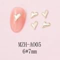 Macro detail of MZH-A005 gold heart nail art alloy charms with 6x7mm dimensions - Irregular Mirror Heart (A005) / 10 Pieces Pack / Gold