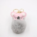 Detail of pink faux leather koala bag charm with grey faux fur pom pom and gold clasp - Light Gray