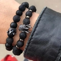 Detailed view of men's beaded bracelets with black lava stone and crown charm on wrist - Matte Black