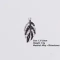 Detailed view of silver leaf pendant with black enamel inlay and sparkling rhinestones - Style 4 Leaf / Silver