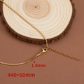 1.8mm golden titanium steel box chain necklace with lobster clasp on wood - Box Chain / Gold