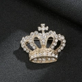 Luxurious gold crown brooch with sparkling rhinestones on black leather background - Crown Gold