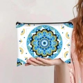 Detailed view of evil eye mandala travel pouch with blue patterns and black zipper - Vibrant Mandala Geometric (jiaying0035)