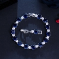 Detail of blue square zirconia and round white stones on a silver plated brass bracelet - Royal Blue