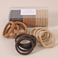 Detail of high-elastic hair bands in earthy tones stored in a clear plastic organizer box - Coffee Mixed Style (Boxed)