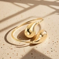 Detailed view of polished 18k gold plated teardrop cuff bracelet with mirror finish - Waterdrop Style (Gold) / Adjustable