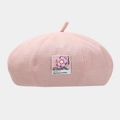 Detailed view of pink knitted beret featuring colorful HS-TREAND floral patch - One Size / Pink
