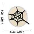 6cm spider web embroidery patch with black web on white base and circular border - Letter Q