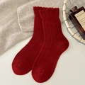 Dark red wool blend socks with colorful flecks and ruffled edges in a cozy knit style - Red