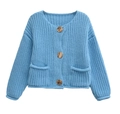 Detail of blue chunky knit cardigan featuring gold buttons and dual front pockets - S / Sky Blue