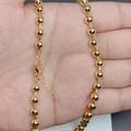 Close-up of a 18K gold plated bead chain necklace with lobster clasp and extension chain - Metal Ball Bead Chain
