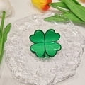 Green acrylic four-leaf clover hair claw clip displayed on glass tray with tulips - Four-leaf Clover 5*4.5cm
