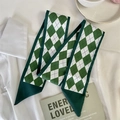 Detail of green and white diamond pattern silk scarves on a white shirt background - B-Diamond Check