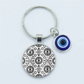 Silver alloy evil eye keychain with blue bead and black geometric glass pendant - B&W Geometric Eye