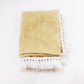 Detail of ginger cotton baby blanket with white cherry prints and elegant crochet tassels - 80x65cm / Ginger Cherry