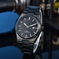 Macro detail of the PRX quartz watch black waffle dial with silver hands and date window - 3-Black Case Black Dial