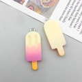 Detailed close-up of gradient resin ice cream pendants with silver metal rings for DIY jewelry - Light Yellow