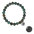 Macro shot of silver heart pendant with 100 languages projection on green stone bracelet - African Pine Stone Bracelet