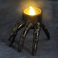 Halloween spider skeleton hand LED candle lamp with warm yellow light and antique gold finish - Skeleton Hand Candle