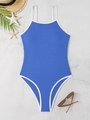 Detailed flat lay of royal blue ribbed swimsuit with white trim and vacation props - S / Blue