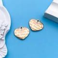 Two heart-shaped KC gold pendants with love engraving on a blue background - 1pc KC Gold Heart Love You Letter 13.5x12mm