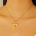 Close-up of textured 18k gold plated cross pendant necklace worn on a model's neck - 18K Real Gold G-322 Diagonally Textured Cross Necklace