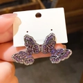 Detail of silver needle stud earrings with purple butterfly design and shimmering crystals - 75# Silver Earring Post - Black Purple