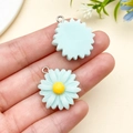 Pair of light blue resin daisy flower charms with yellow center and metal rings - Lake Blue