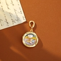 Vintage heart pearl pendant with colorful gems and gold frame on leather background - Purple Blue and Yellow Gradient Heart Pearl Style