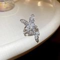 Macro detail of silver butterfly ring with micro-pave cubic zirconia crystals - Silver