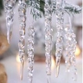 Clear acrylic icicle ornaments with spiral texture hanging on snowy Christmas tree branches - 13cm Icicle 12pcs