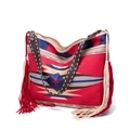 Macro detail of bohemian woven bag with geometric patterns and red fringe tassels - Style 6
