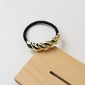 Black high-elastic hair tie with a twisted golden metallic accent on a wooden stand - 43# Spiral Gold