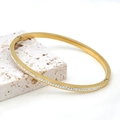 Detail view of 18k gold plated stainless steel bangle with sparkling zircon stones - Gold Half Row Zirconia