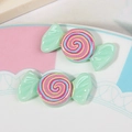 Macro view of colorful resin candy swirl charms for DIY hair accessories and phone cases - Pale Green