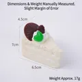Triangle mousse cake squishy toy in white cream with chocolate and berry decor - White