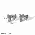Macro shot of silver bow earrings with detailed measurements 16mm x 13.3mm and weight - Silver Bowknot Stud Earrings (TE6923-S)