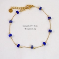 Detail of 14k gold stainless steel bracelet with blue beads and S.Steel logo tag - Lapis Lazuli Beaded Bracelet