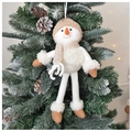 Detail of plush Christmas snowman hanging on a tree with knitted hat and long legs - Boy Snowman
