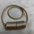 Champagne gold magnetic curtain tieback with a woven texture finish and rope - Champagne