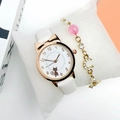 Detail of white cat dial watch with gold star and moon bracelet set on display pillow - Watch + Bracelet / White