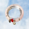 Pink beaded bracelet with gold Fu pendant and red bead accents on mirror background - -s004- Pink Bamboo-shaped Bracelet With Red Beads And The Character "福" (fu Meaning Good Fortune) #sz056